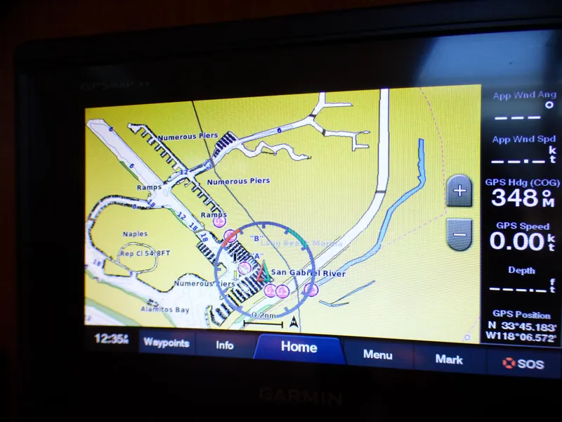 Slide: The Image of Garmin GPS display showing nautical map and coordinates on a J Boats J/109, 2002 model. - 10