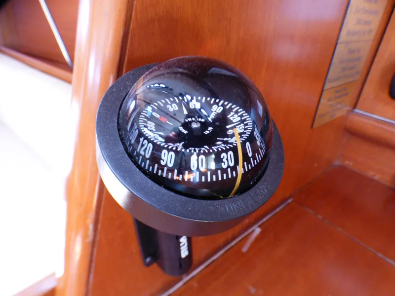 Slide: The Image of Compass on 2002 J Boats J/109 yacht, mounted on wooden panel. - 12