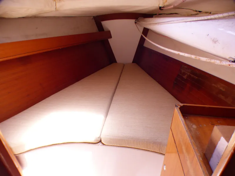 Slide: The Image of Interior cabin of 2002 J Boats J/109 sailboat with wooden finish and cushioned berth. - 17