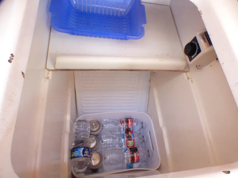 Slide: The Image of Cooler with water bottles and cans inside a J Boats J/109, 2002 model. - 21