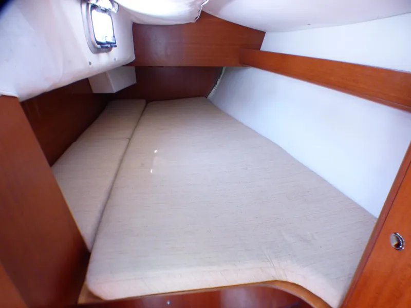 Slide: The Image of Cozy cabin interior of 2002 J Boats J/109 sailboat with wooden finish. - 23