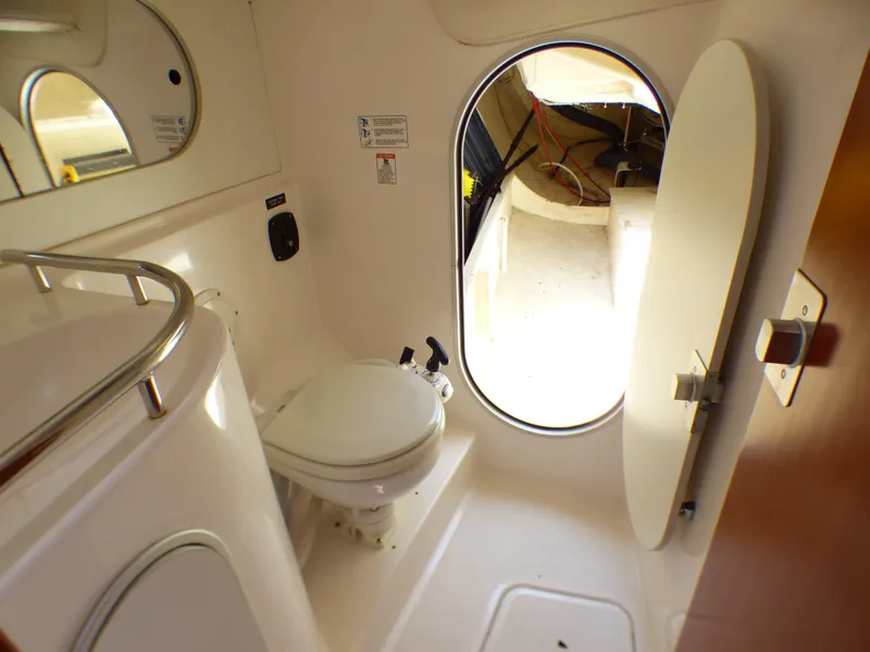Slide: The Image of Interior of a 2002 J Boats J/109 yacht bathroom with toilet and open door. - 28