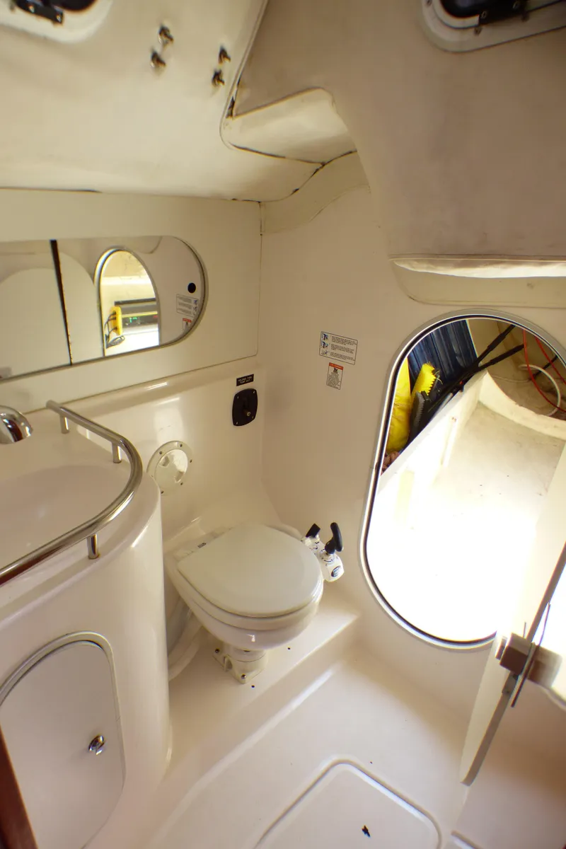 Slide: The Image of Interior of 2002 J Boats J/109 yacht bathroom with toilet and mirror. - 29