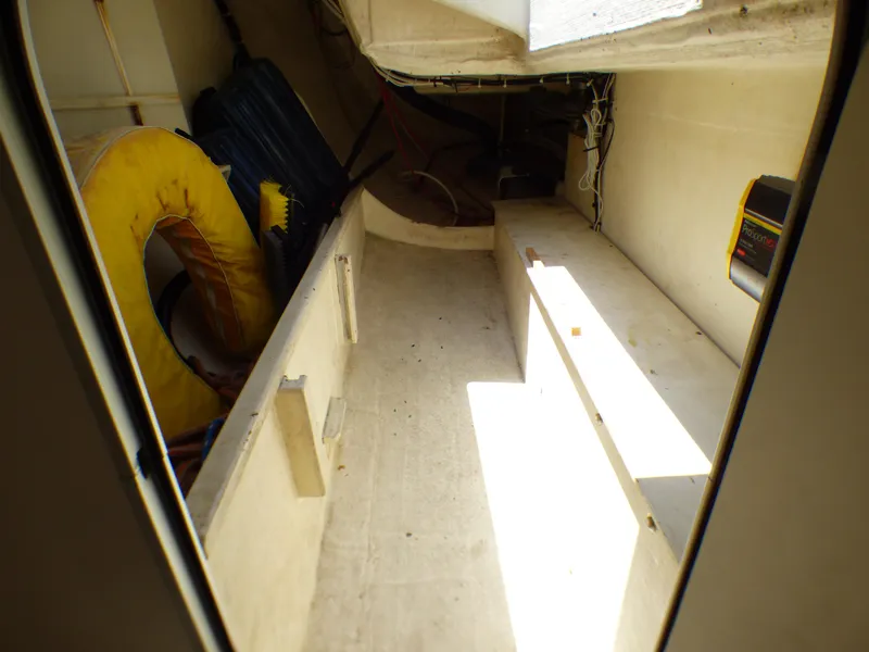 Slide: The Image of Interior view of a 2002 J Boats J/109 sailboat, showing storage space and equipment. - 30