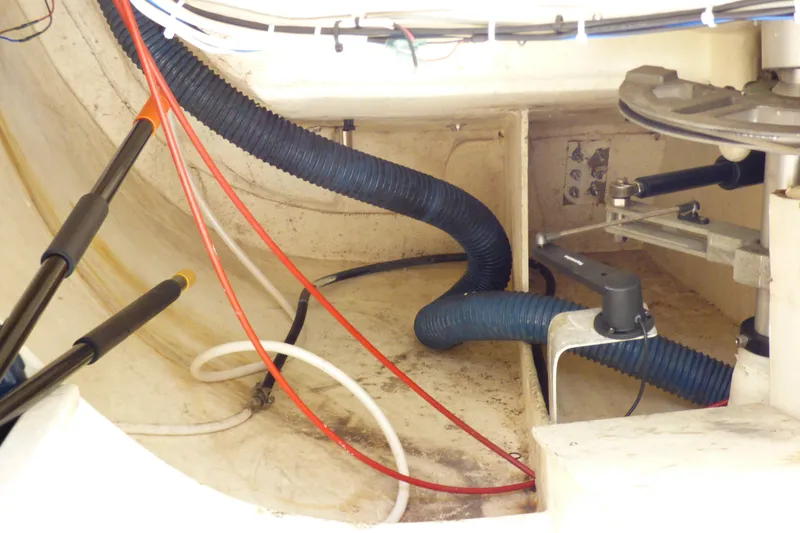 Slide: The Image of Interior view of a 2002 J Boats J/109 sailboat, showcasing cables and mechanical components. - 31