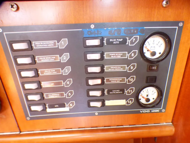 Slide: The Image of Control panel of a 2002 J Boats J/109, featuring switches and gauges. - 6