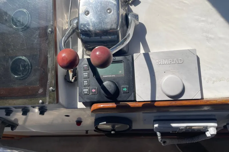 Slide: The Image of 1978 Californian Tri-Cabin Trawler control panel with Simrad navigation system. - 14