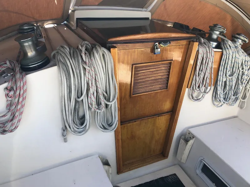 Slide: The Image of Interior of 1989 Nonsuch 33 sailboat with ropes and wooden hatch. - 14