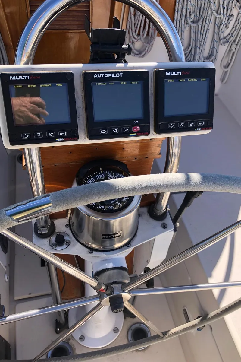 Slide: The Image of Steering wheel and navigation instruments on a 1989 Nonsuch 33 sailboat. - 16
