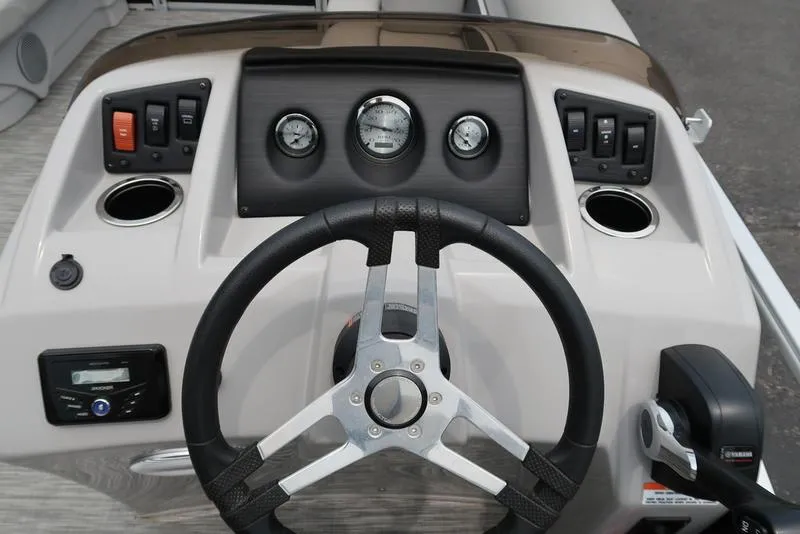 Slide: The Image of 2020 Bennington 20 SLV boat dashboard with steering wheel and control panel. - 13