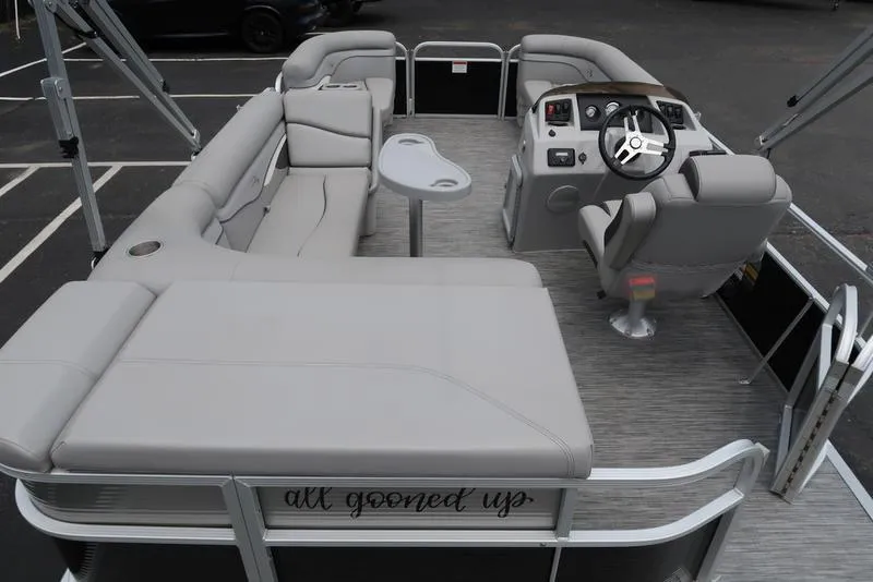 Slide: The Image of 2020 Bennington 20 SLV pontoon boat interior with gray seating and steering console. - 16