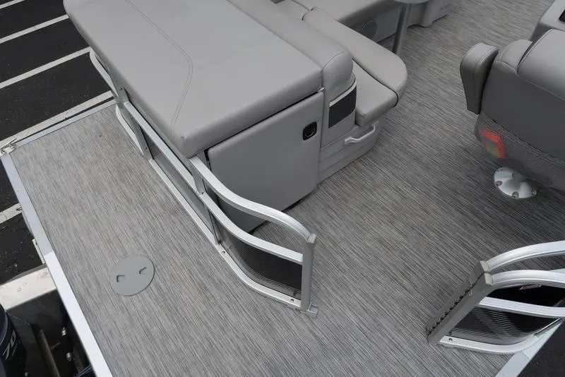 Slide: The Image of 2020 Bennington 20 SLV pontoon boat interior with gray seating and flooring. - 18