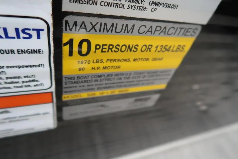 Slide: The Image of Capacity label on 2020 Bennington 20 SLV boat, max 10 persons or 1354 lbs, 90 HP motor. - 19