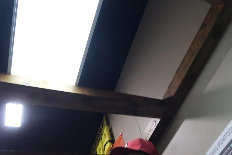 Slide: The Image of Ceiling with wooden beams and bright fluorescent lights. - 4