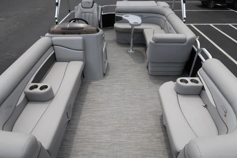Slide: The Image of 2020 Bennington 20 SLV pontoon boat interior with gray seating and cup holders. - 6