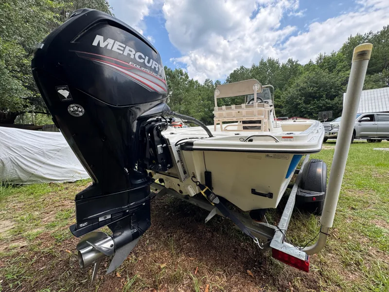 Slide: The Image of 2017 Mako Pro Skiff 19 CC with Mercury outboard motor on trailer. - 13