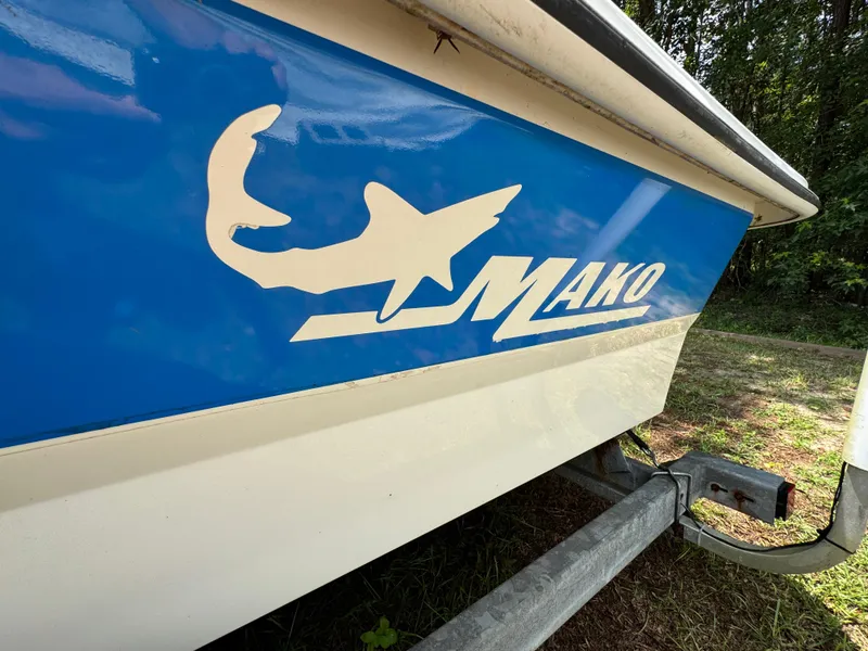 Slide: The Image of 2017 Mako Pro Skiff 19 CC boat with logo on trailer. - 3