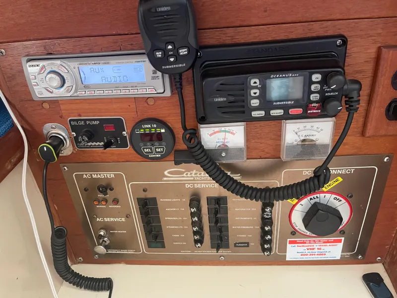 Slide: The Image of Control panel of a 1986 Catalina 34 yacht with radio and electrical switches. - 41