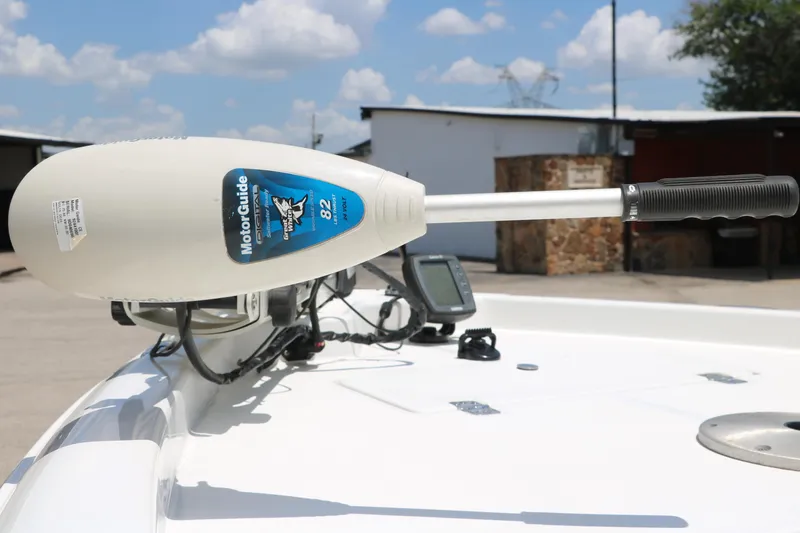 Slide: The Image of MotorGuide trolling motor on 2011 Sea Hunt XP-21 boat under a clear sky. - 11