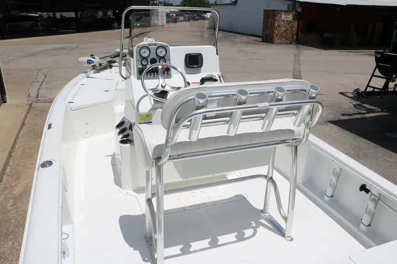 Slide: The Image of 2011 Sea Hunt XP-21 boat interior with steering console and seating. - 13