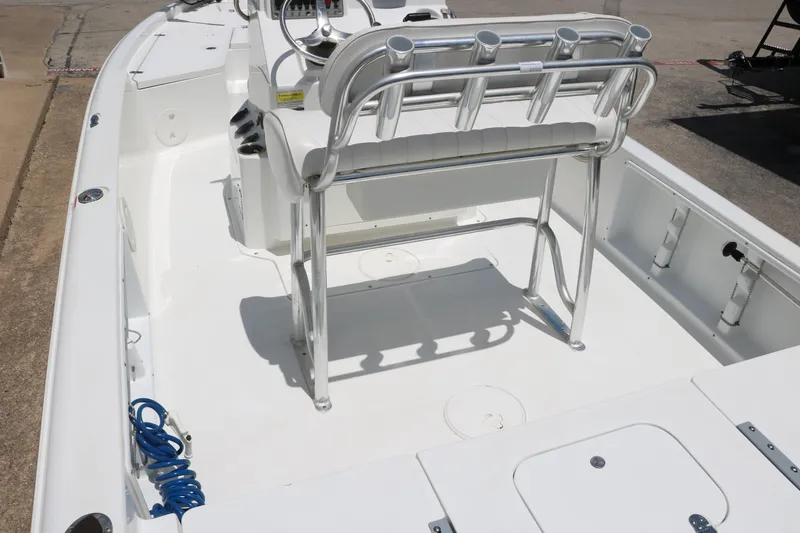 Slide: The Image of 2011 Sea Hunt XP-21 boat interior with seating and rod holders. - 14