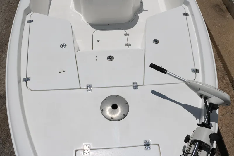 Slide: The Image of 2011 Sea Hunt XP-21 boat deck with storage compartments and trolling motor. - 20
