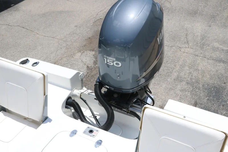 Slide: The Image of 2011 Sea Hunt XP-21 boat with Yamaha 150 outboard motor, rear view. - 27