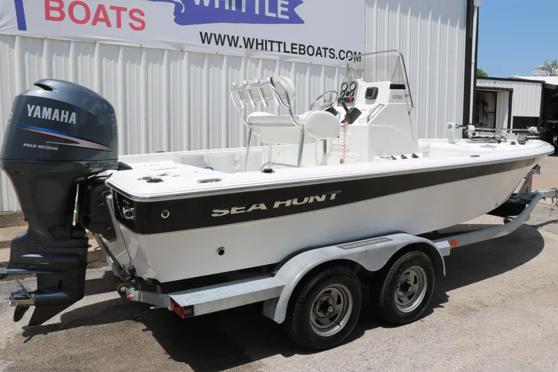 Slide: The Image of 2011 Sea Hunt XP-21 boat with Yamaha engine on trailer at Whittle Boats dealership. - 3