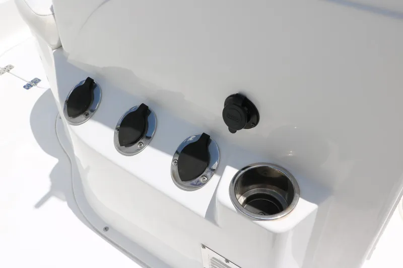 Slide: The Image of Boat console with cup holder and covered outlets, Sea Hunt XP-21, 2011 model. - 30