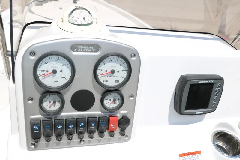Slide: The Image of Dashboard of 2011 Sea Hunt XP-21 boat with gauges and Garmin fishfinder. - 31