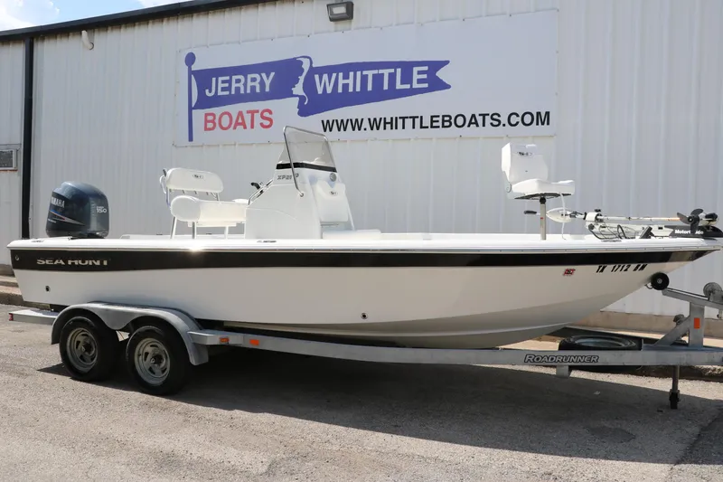 Slide: The Image of 2011 Sea Hunt XP-21 boat on trailer at Jerry Whittle Boats dealership. - 36