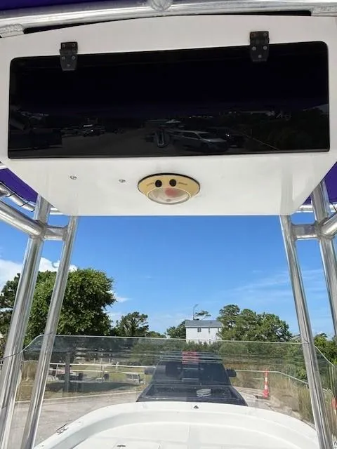 Slide: The Image of 2008 Carolina Skiff 218DLV boat deck with open storage compartments and life jackets. - 11