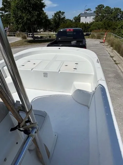 Slide: The Image of 2008 Carolina Skiff 218 DLV T-top with blue canvas and stainless steel frame. - 12