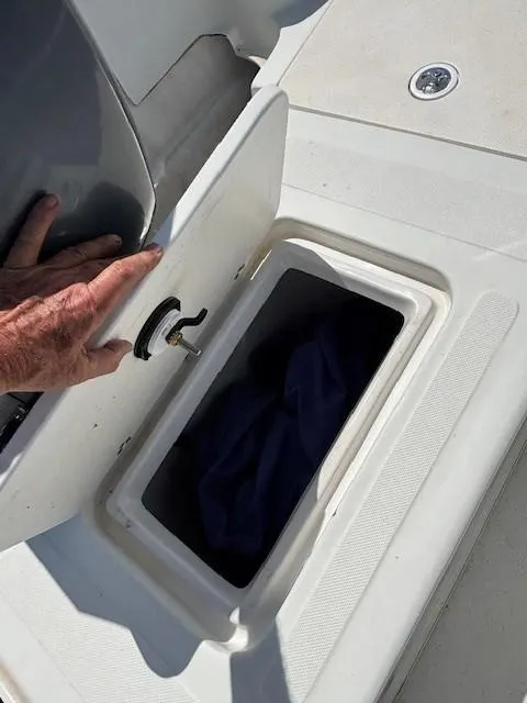 Slide: The Image of 2008 Carolina Skiff 218 DLV boat electronics, featuring Raymarine radio and West Marine stereo. - 17