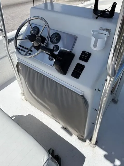 Slide: The Image of 2008 Carolina Skiff 218 DLV boat with T-top and seating, black and white image. - 19