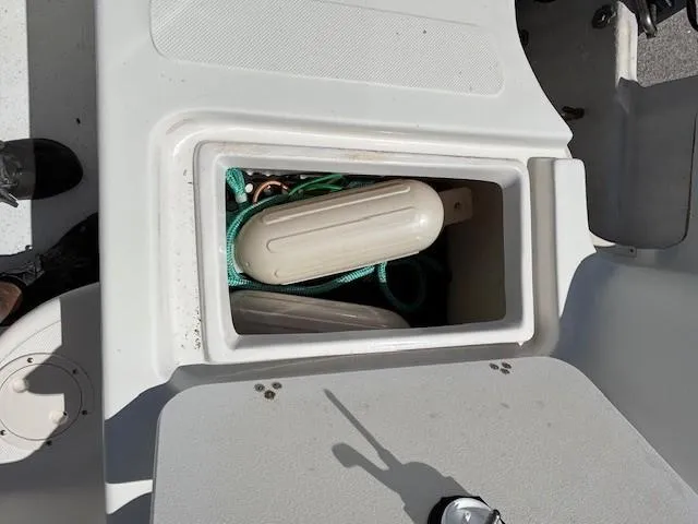 Slide: The Image of Storage compartment on a 2008 Carolina Skiff 218DLV boat with marine equipment. - 29
