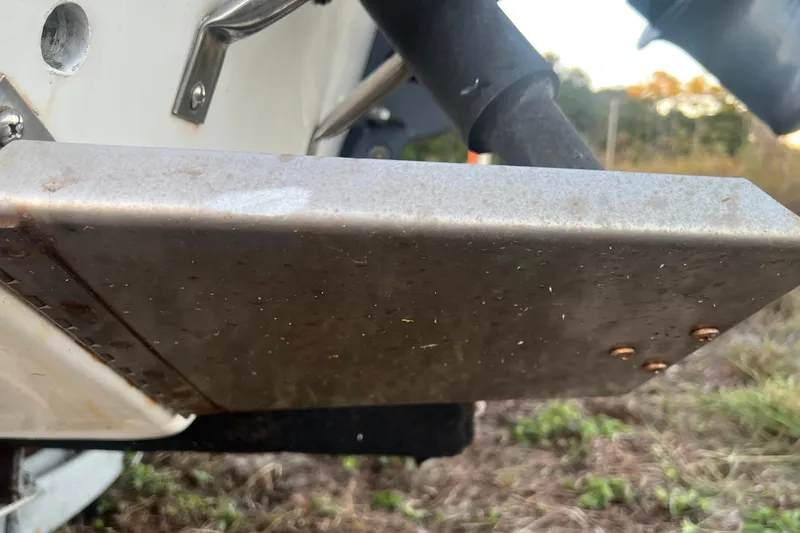 Slide: The Image of Close-up of a 2008 Carolina Skiff 218 DLV boat's metal component, showing wear and rust. - 32