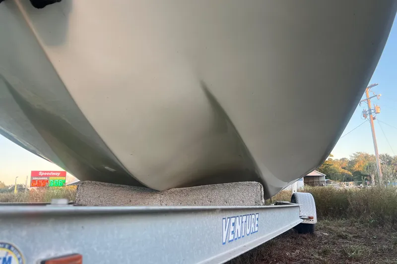 Slide: The Image of 2008 Carolina Skiff 218 DLV boat on Venture trailer, roadside view. - 36