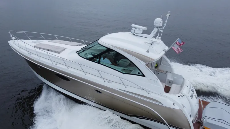 Slide: The Image of 2008 Formula 45 Yacht cruising on open water, showcasing sleek design and performance. - 10