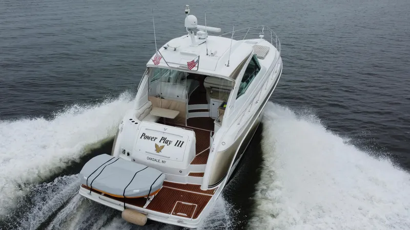 Slide: The Image of 2008 Formula 45 Yacht cruising on open water, rear view with wake. - 16