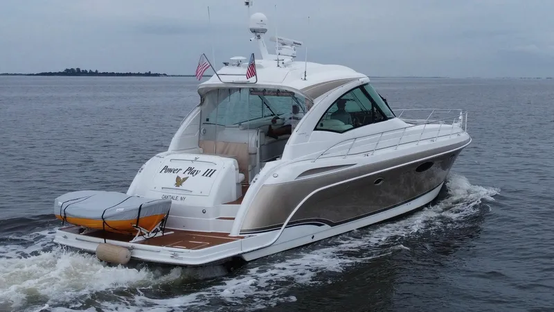Slide: The Image of 2008 Formula 45 Yacht cruising on open water, rear view with flags and equipment. - 18