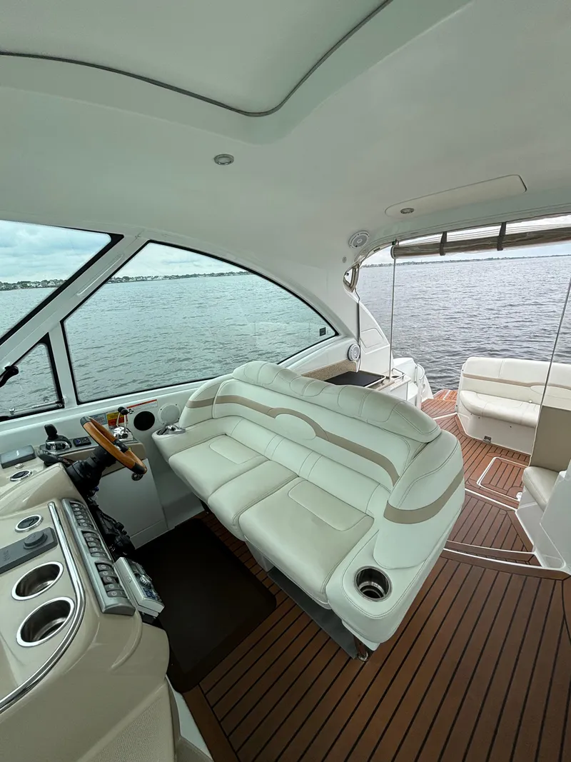 Slide: The Image of 2008 Formula 45 Yacht interior with leather seating and wooden deck, overlooking the water. - 33