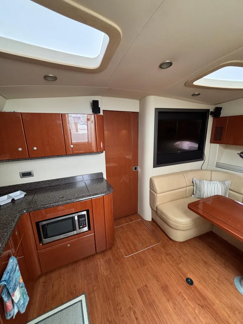 Slide: The Image of Interior of 2008 Formula 45 Yacht with kitchen, seating, and TV. - 44