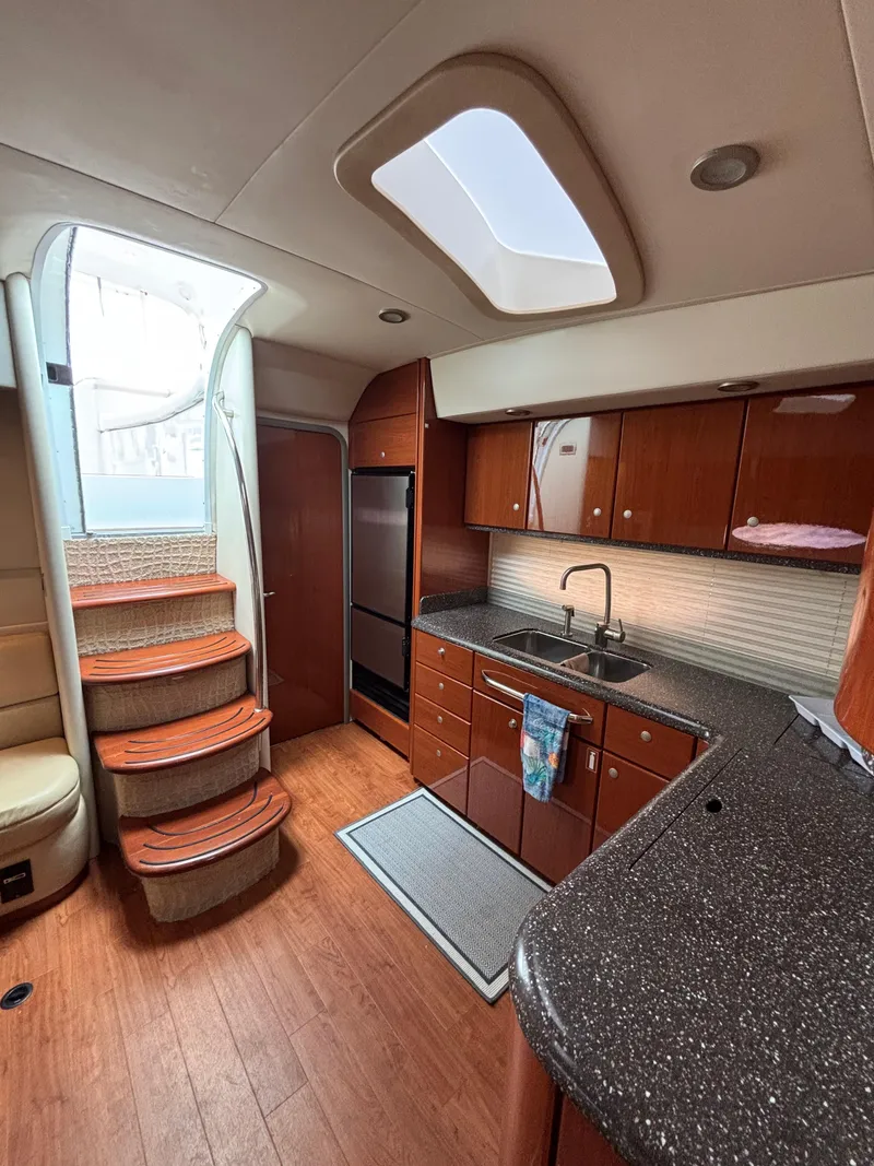 Slide: The Image of Interior of 2008 Formula 45 Yacht with modern kitchen and wooden cabinetry. - 45