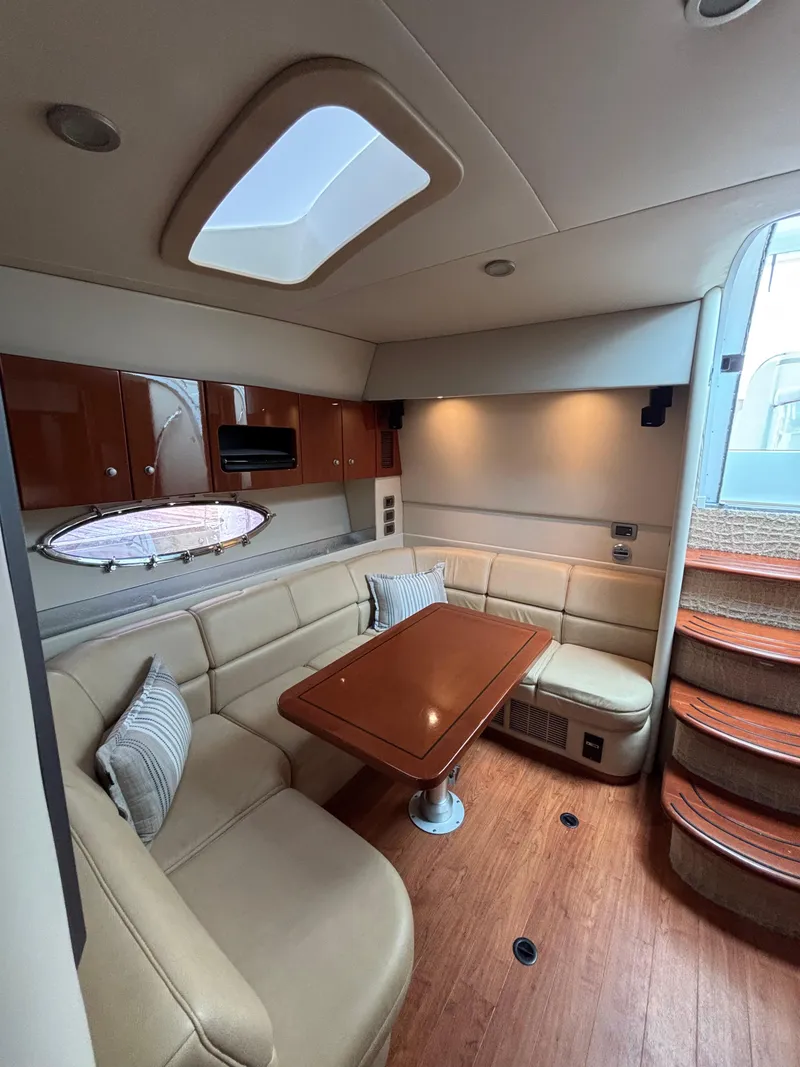 Slide: The Image of Luxurious interior of 2008 Formula 45 Yacht with leather seating and wooden table. - 46