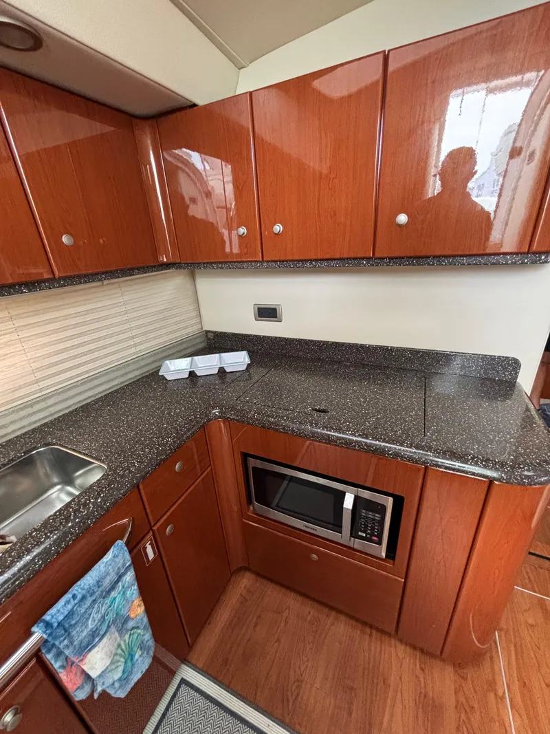 Slide: The Image of 2008 Formula 45 Yacht kitchen with wood cabinets and modern appliances. - 51