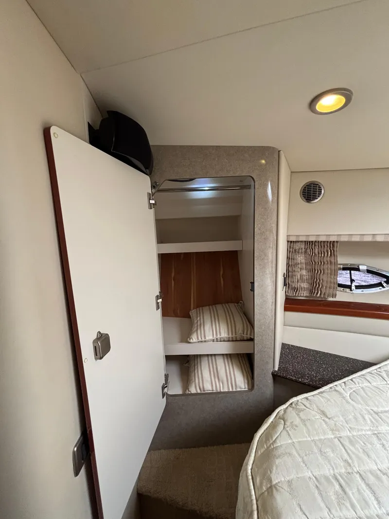 Slide: The Image of Interior cabin of 2008 Formula 45 Yacht with cozy bedding and storage. - 57