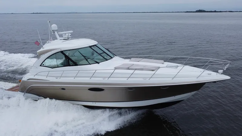 Slide: The Image of 2008 Formula 45 Yacht cruising on open water, showcasing sleek design and luxury features. - 6