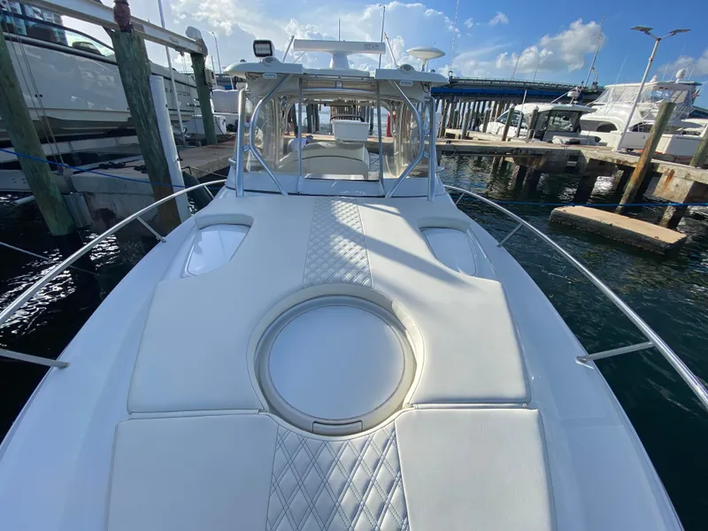 Slide: The Image of 2006 Hydra-Sports Vector 3300 VX boat docked at marina under blue sky. - 12