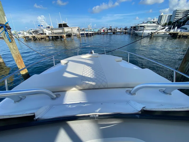 Slide: The Image of 2006 Hydra-Sports Vector 3300 VX boat docked at marina under clear blue sky. - 13